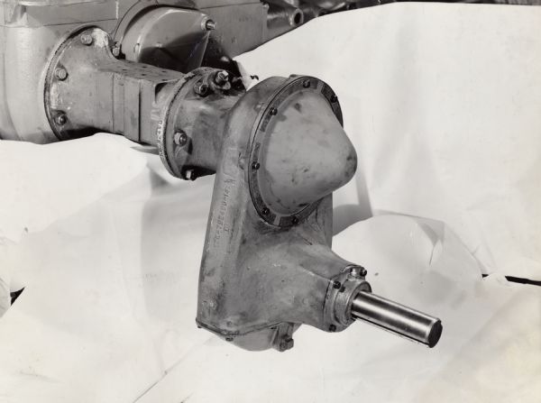 Engineering photograph of the high clearance rear axle housing of a cotton harvester [picker] mounted on a Farmall H tractor.