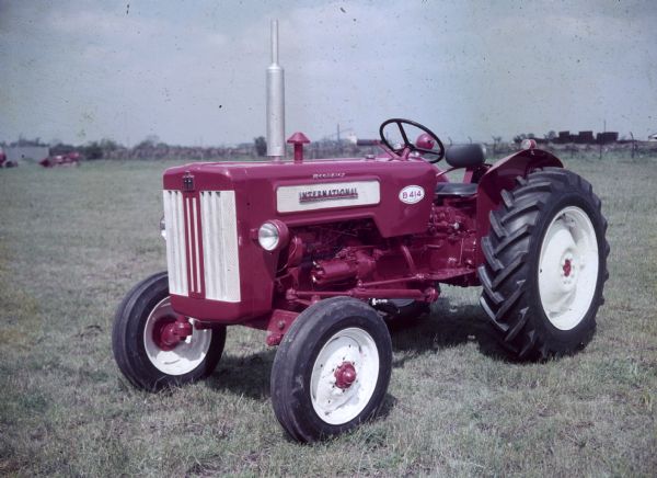 Color photograph of a British-built B-414 diesel tractor in a field.