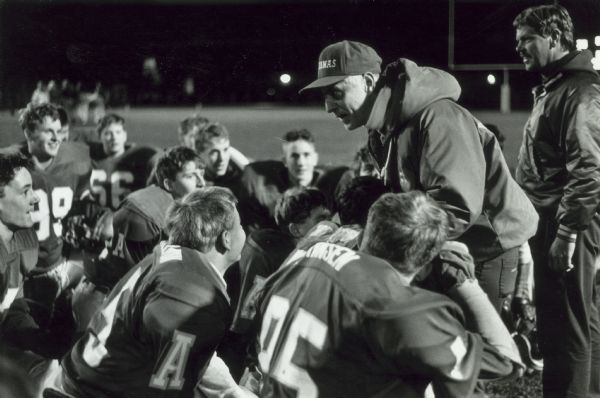 Head coach Dan Coughlin addresses his players, the Aquinas Bluegold Varsity football team, after his team's first playoff spot was clinched at the close of his first season as head coach.