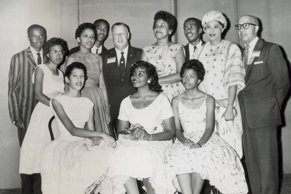 Daisy Bates and the Little Rock Nine with officers of the NAACP at their 49th annual convention. Mrs. Bates and the nine students received an award for their heroism during the school integration crisis in September, 1957. Pictured seated in row 1, left to right: Carlotta Walls, Melba Pattillo, and Elizabeth Eckford. Standing in Row 2 are, left to right: Terrence Roberts, Thelma Mothershed, Gloria Ray, Jefferson Thomas, Kivie Kaplan (of the NAACP), Minnijean Brown, Ernest Green, Daisy Bates, and James B. Levy, president of the Cleveland NAACP chapter.