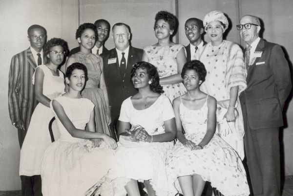 Daisy Bates and the Little Rock Nine with officers of the NAACP at their 49th annual convention. Mrs. Bates and the nine students received an award for their heroism during the school integration crisis in September, 1957.  Pictured seated in row 1, left to right: Carlotta Walls, Melba Pattillo, and Elizabeth Eckford.  Standing in Row 2 are, left to right: Terrence Roberts, Thelma Mothershed, Gloria Ray, Jefferson Thomas, Kivie Kaplan (of the NAACP), Minnijean Brown, Ernest Green, Daisy Bates, and James B. Levy, president of the Cleveland NAACP chapter.