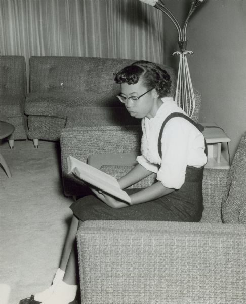 Thelma Mothershed, one of the Little Rock Nine, reading a book.