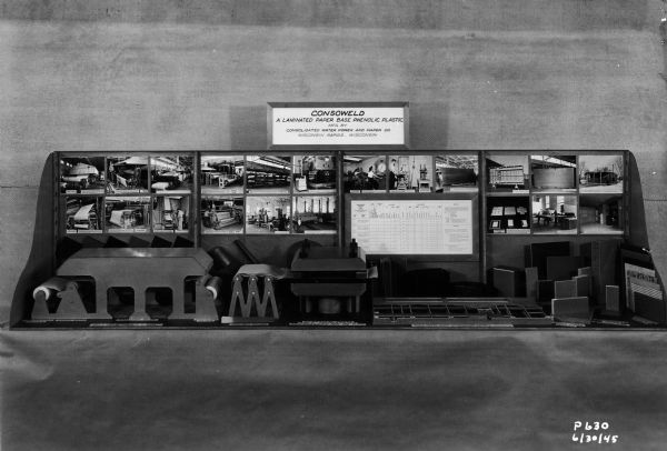 Exhibit developed by the Plastics Division of Consolidated Papers, Inc., of Wisconsin Rapids, concerning the manufacture of a paper-based plastic, consoweld, developed as a result of its war work.  The exhibit consists of a model of the machinery which made the laminate, and photographs.  Most of the photographs in the display are available as part of Wisconsin Historical Images. The Plastics Division later became known as Consoweld.