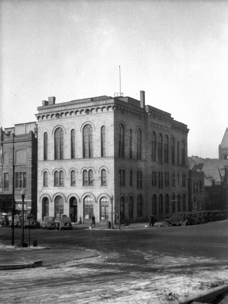 Madison City Hall, 2 West Mifflin Street, built in 1857, originally had a small Romanesque clock tower in the corner closest to the camera in this photograph.