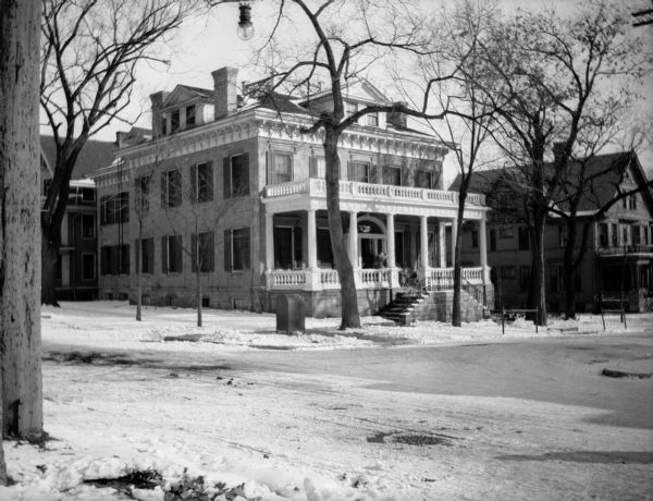View from across Langdon Street looking toward the residence of Levi B. Vilas.  Built in 1851, the house was later used by the Phi Gamma Delta and then Sigma Phi Epsilon fraternities until 1965, when the house was razed.