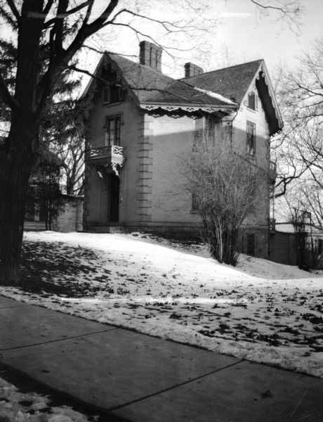 The Jarvis-Ward-Atwood octagon house, 121 West Wilson Street, built for Mr. Jarvis from red brick made at a kiln, owned by W.A.P. Morris, at the turn of Langdon Street. The brick for Governor Farwell's octagonal house also came from this kiln. The Jarvis house was so expensive to build, however, that it had to be mortgaged. Only three of the fourteen rooms in the house are four-sided. The house later had a spiral staircase from the first to the fourth floor, and had eighteen steps per flight. It was later remodeled and used as a headquarters for the Salvation Army.