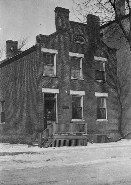 The Michael Fry / Frye ? house, 454 West Gilman Street, built in 1851 by Mr. Fry, who came here from Germany. His wife lived in the house until 1916.  It is made of brick laid in ordinary bond, with wooden lintels over the door and front windows. Grimms book bindery was later built on the property.
