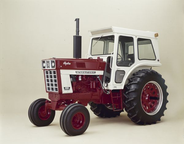 Color studio photograph of the Farmall 1066 Hydro tractor with a full, covered cab.