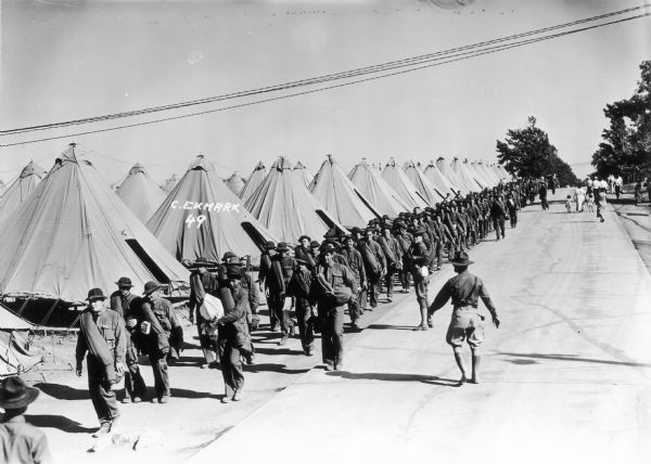 Members of the Civilian Conservation Corps (CCC), probably Company 1604, in uniform and in formation, possibly at Fort Sheridan, Illinois.