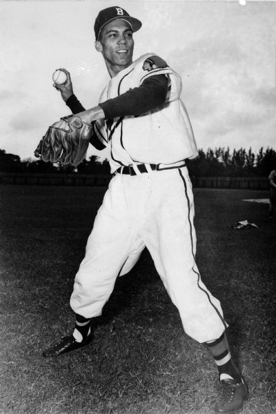 Milwaukee Braves player William 'Billy' Bruton gets ready to throw a ball during spring training practice.