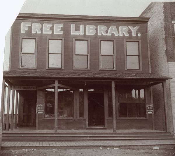 Exterior view of the Free Library at Wausaukee located above a restaurant.