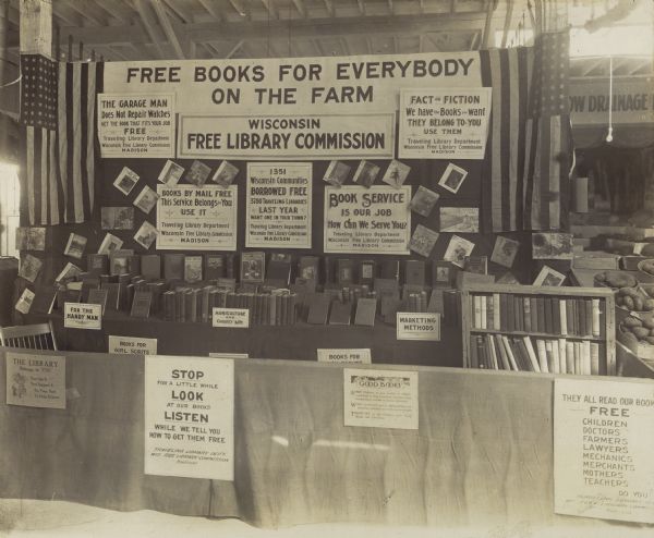 Booth at the Wisconsin State Fair promoting the Wisconsin Free Library Commission.