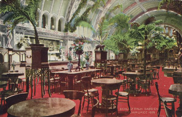 Hand-colored postcard of the interior of the Schlitz Palm Garden. Located on N. 3rd Street, south of W. Wisconsin Avenue, the Schlitz Palm Garden opened on July 3, 1886 and was one of the most popular and opulent in Milwaukee. Caption reads: "Schlitz Palm Garden, Milwaukee."