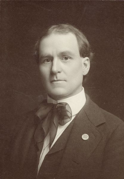 Studio portrait of Frederick Heath, newspaper man from Milwaukee. He wears a Social Democratic Party pin on his lapel.