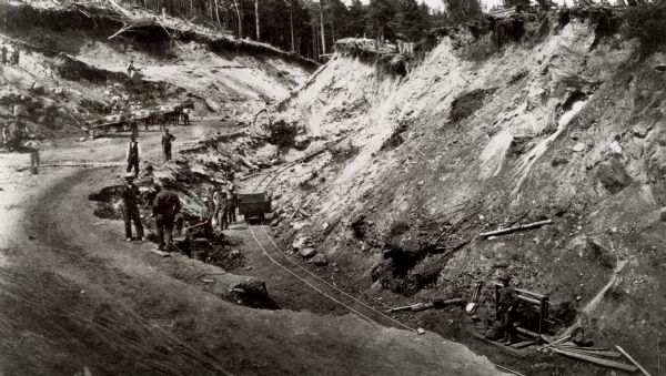 Men working in an iron mine.