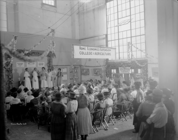 Clothing demonstration for women by the University of Wisconsin Agricultural Extension at the 1921 Wisconsin State Fair.