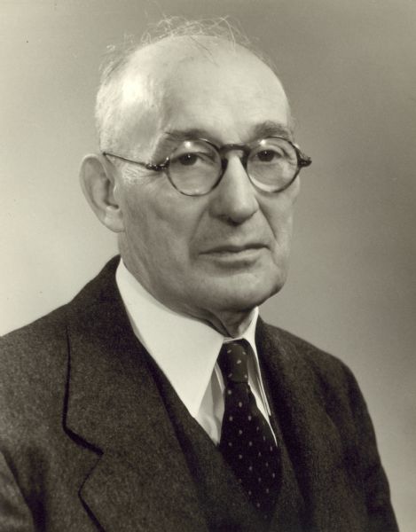 Studio portrait of Arthur W. Page wearing eyeglasses and a necktie.