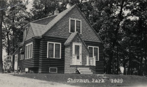 Exterior of the house at 1422 Sherman Avenue, built by Willard Droster, in the Sherman Park neighborhood. Children are playing on the left.