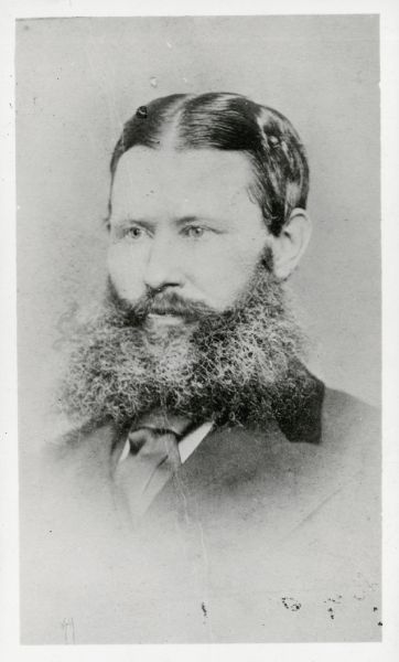Head and shoulders portrait of Jeremiah Curtin with a full beard.