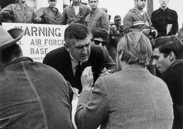 At a sit-down demonstration at Truax Air Force Base, a journalist interviews one of the demonstrators.
