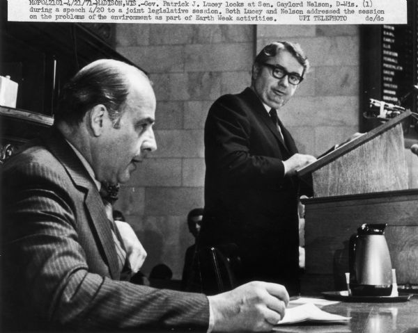 Wisconsin Senator Gaylord Nelson, who is credited with conceiving of Earth Day, listens while Wisconsin Governor Patrick J. Lucey addresses the Wisconsin Legislature during an event in Madison marking the second Earth Day ceremonies.