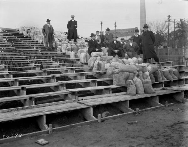 University of Wisconsin-Madison bleachers at Camp Randall Field undergoing weight test for proper load. They should support 6900 pounds per girder with maximum deflection 1.06".