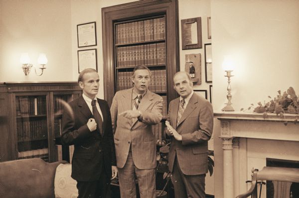 An informal moment during a photography session in the office of Senator Gaylord Nelson. Included, left to right, are Senator William Proxmire, Congressman Robert Kastenmeier, and Nelson.
