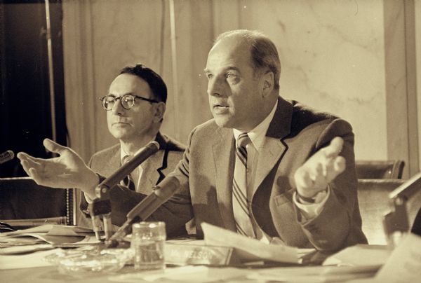 Nelson, as chairman of the Monopoly Subcommittee, holding a hearing regarding the abuses of the pharmaceutical industry. He is sitting at a table behind a microphone as he questions a witness.