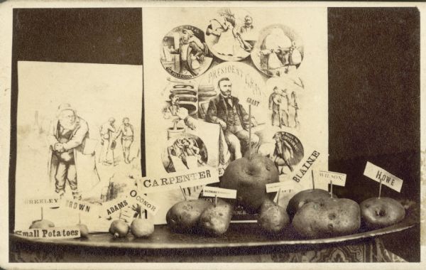 Ulysses S. Grant loyalist demonstrates his strength in a display showing various sized potatoes with politicians names attached. The opposition is depicted as "small potatoes".