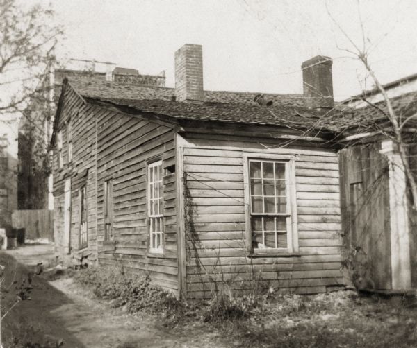 The Doty House on Doty Street (formerly Clymer Street), the first "Executive Mansion" in Madison, occupied in 1841-1844 by Territorial Governor James Duane Doty. When new, it was considered one of the choicest small houses in Madison. It was built by Simon Mills, who sold it to Doty; it was subsequently occupied by Governor Tallmadge (who succeeded Doty), Barlow Shackelold (Doty's brother-in-law), and was later owned by George Burrows, who owned the Opera House next door, and the Williams family. Burrows had the building demolished.