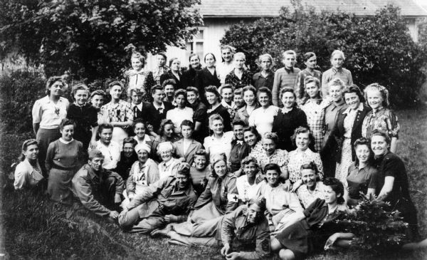 Group portrait of Holocaust survivors in quarantine after World War II; Smalands Anneberg, Sweden, Summer.