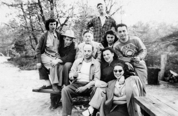 Group portrait of Pela Rosen Alpert, Richard Alpert, and friends at a picnic.