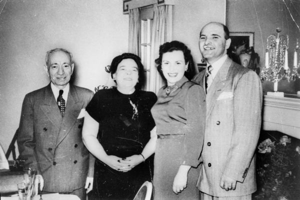 From left: Mr. and Mrs. Blum (relatives), Pela Rosen Alpert, Richard Alpert, at their engagement party in the house of Pela's sister.