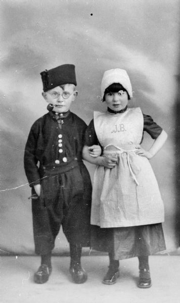 The brother of Flora van Brink Hony Bader (nee Melkman), Harry Melkman, and a friend, are dressed up for Purim party; Amsterdam.