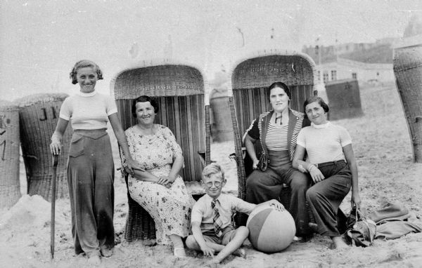 Left to right: Flora van Brink Hony Bader (nee Melkman), mother Duifje Melkman, brother Harry Melkman, aunt Rebecca Veerman, sister Annie Melkman. They are at the seashore in Holland.
