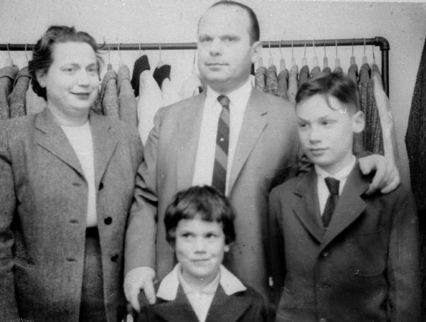 Group portrait of Deutschkron family (from left): Eva Lauffer Deutschkron, Martin, Ruth, and Edward, at Martin's tailor shop, 419 State Street.