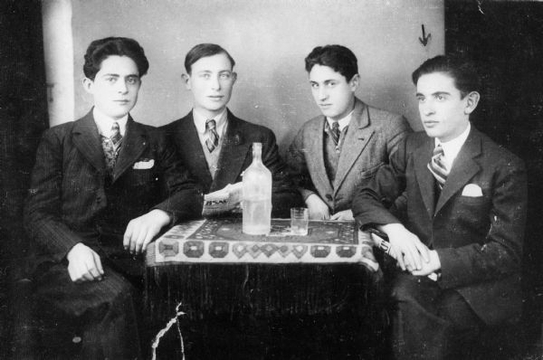 Louis Koplin's uncle, Schlomo Kopolowitz (far right), and friends, all of whom fled to Russia shortly after the photograph was taken; Munkacs, Czechoslavakia.