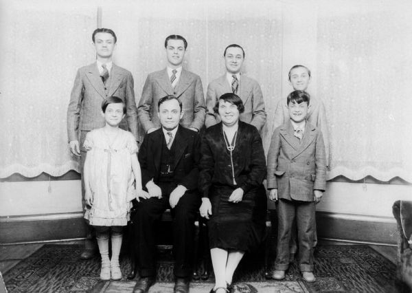 Portrait of the Seiden family (wife and in-laws of Salvator Moshe).  Front row, from left: Thelma Seiden Moshe (wife), Max (father-in-law), Bessie (mother-in-law), Sidney.  Back row, from left: Joseph, Ben, Charles, and Eli.