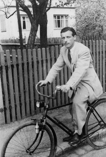 Walter Wolf Peltz on bicycle; Memmingen, Germany.