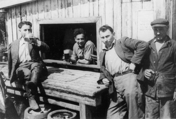 Refugees patronizing a "beer-bar," run by invalids at a Displaced Persons camp in Germany.

