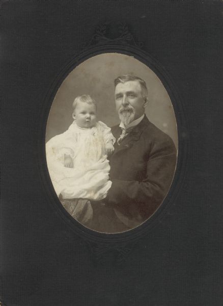 Portrait of the Honorable Charles Donohue, Mayor of New Richmond, Wisconsin, and his grandson, Charles III. The elder Donohue was born December 5, 1843 in Goosebury Hill, Co. Cork in Ireland and died on February 12, 1915 in New Richmond, Wisconsin.