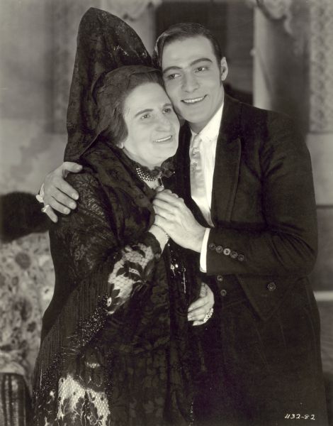 Rudolph Valentino puts his arm around Rosa Rosanova in a publicity still for the silent drama <i>Blood and Sand.<i/>