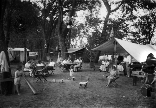 Children and adults at picnic campground owned by Gus Klindt near Cassville.