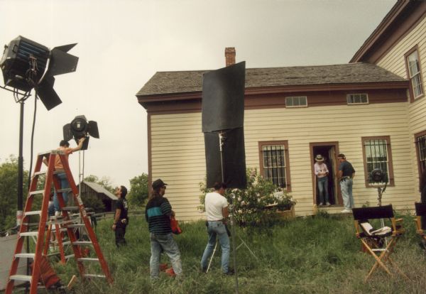 Crew of the made-for-TV movie "Dillinger," which was shot on location at Old World Wisconsin.  Here the crew has transformed the historic Seven Mile Inn for its role as the site of a bank robbery.