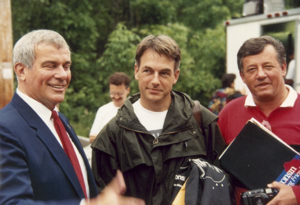 Actor Mark Harmon (center), who portrayed John Dillinger in the made-for-TV movie of the same name, at the Chalet on the Lake in Mequon.  In the film this location was used to represent Little Bohemia. On Harmon's right is Dick Matty, head of the Wisconsin Department of Tourism, of which the Wisconsin Film Office was a part. Dick Rose is on his left.