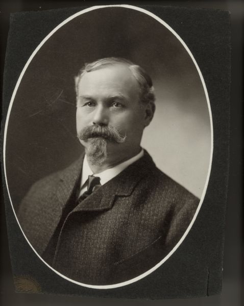 Studio portrait of Nicholas M. Keeley, proprietor of Keeley, Neckerman dry goods store. For many years the store was located at 15 North Pinckney Street.