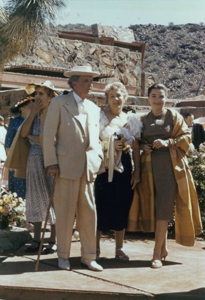 Architect Frank Lloyd Wright with his granddaughter, actress Anne Baxter, and her mother, Wright's daughter from his first marriage, Catherine Dorothy Wright Baxter, at Taliesin West.  This may be just several days prior to Wright's death.