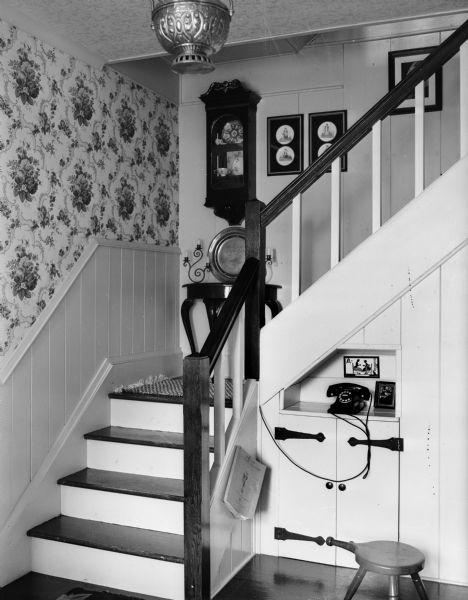 Interior of the Winfield Martin house, 2906 Lakeland Avenue (earlier address: 611 Elmside Boulevard), showing the stairway, with a telephone on a cabinet niche in the landing of the stairway hall. Built as a carriage house for James and Minnie Corry in 1911, it was remodeled as a residence in 1946.