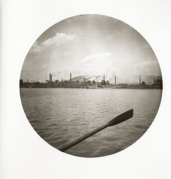 View from the Monongahela River of the Edgar W. Thompson steel works. An oar from Thwaites' boat is visible in the foreground.