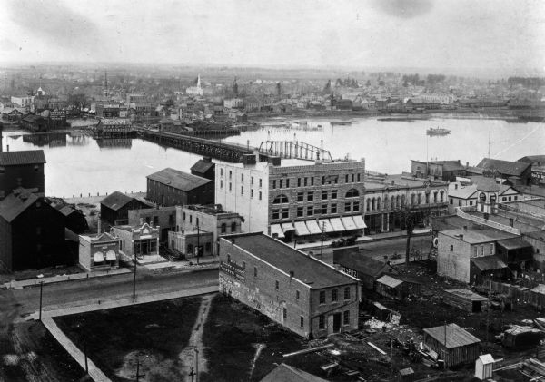 Elevated view of Washington Street and the Fox River and buildings nearby.
